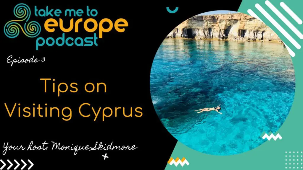Podcast cover with "Take Me to Europe Podcast" text, Episode 3. "Tips on Visiting Cyprus," hosted by Monique Skidmore. Image shows a person swimming in clear blue water near rocky cliffs, reminiscent of the stunning shores you'd find near Vergina.