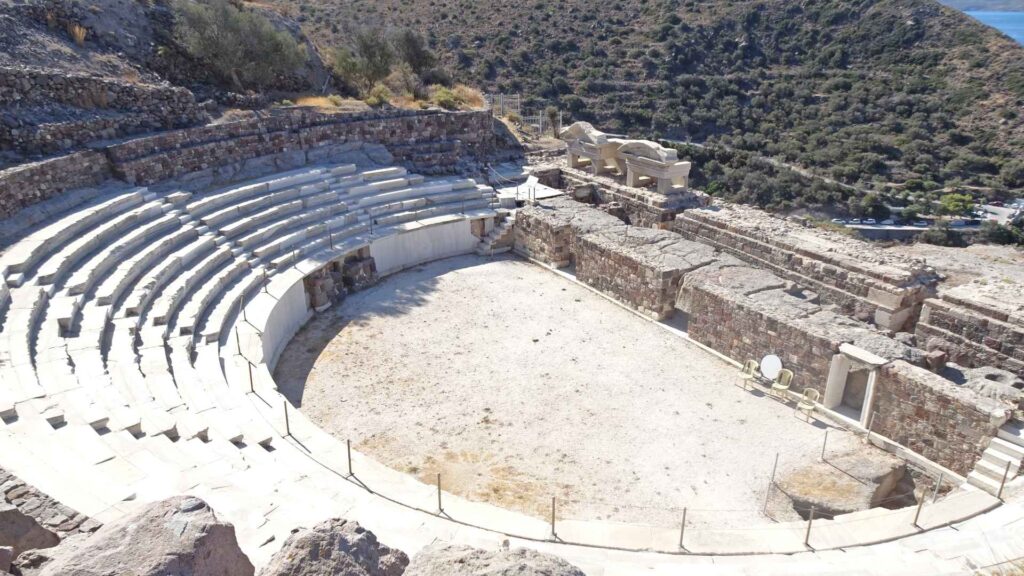 Nestled in the rugged terrain of Milos, this ancient stone amphitheater boasts tiered seating and a central stage, offering visitors an insight into a bygone era. Surrounded by rocky landscapes and sparse vegetation, it is a spectacular highlight for any island guide.
