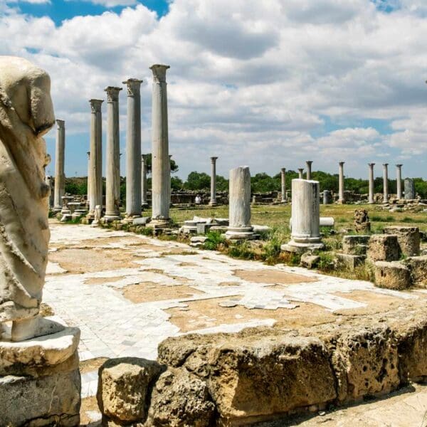 Rows of re-erected marble columns at the gymnasium of ancient Salamis, Cyprus, with the Mediterranean behind