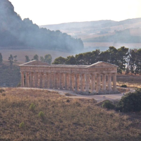 Doric temple of Segesta standing on a grassy hillside in Trapani province, Sicily