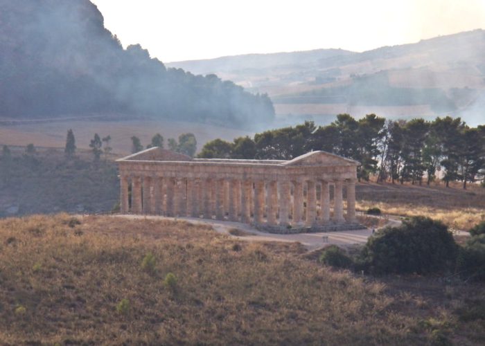 Doric temple of Segesta standing on a grassy hillside in Trapani province, Sicily